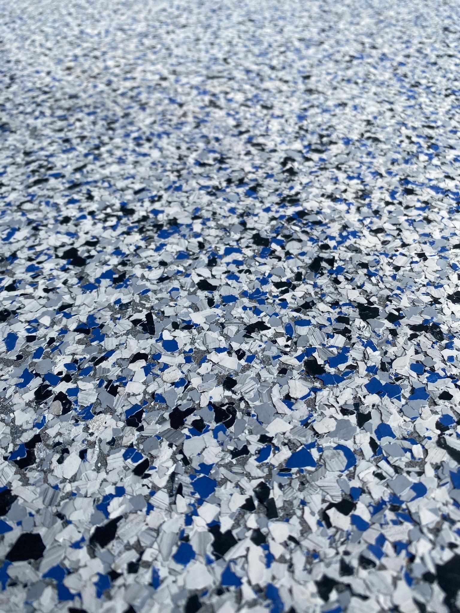 Close-up detail of professional epoxy flake floor texture