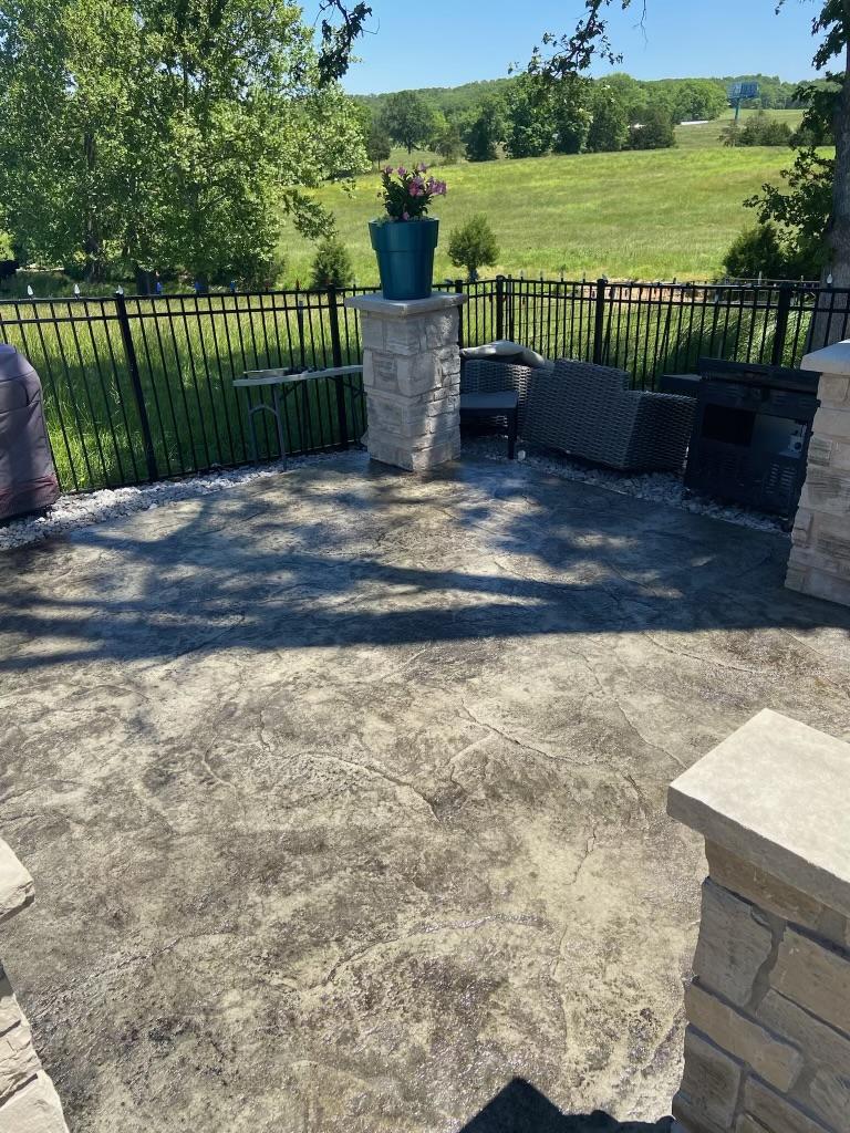 Finished decorative stone-look patio coating with sealed surface
