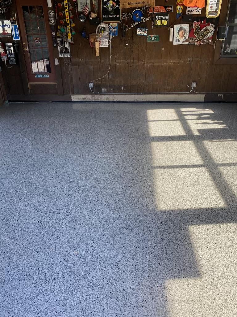 Finished residential garage with glossy flake epoxy floor coating