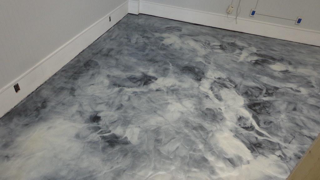 Black and white marble-look metallic epoxy floor