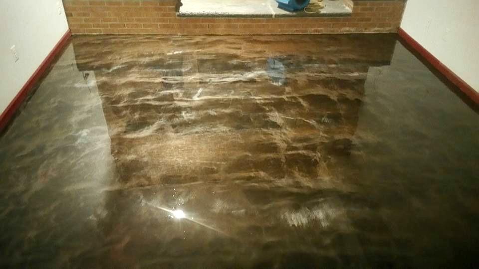 High-gloss metallic epoxy floor with flowing swirl pattern