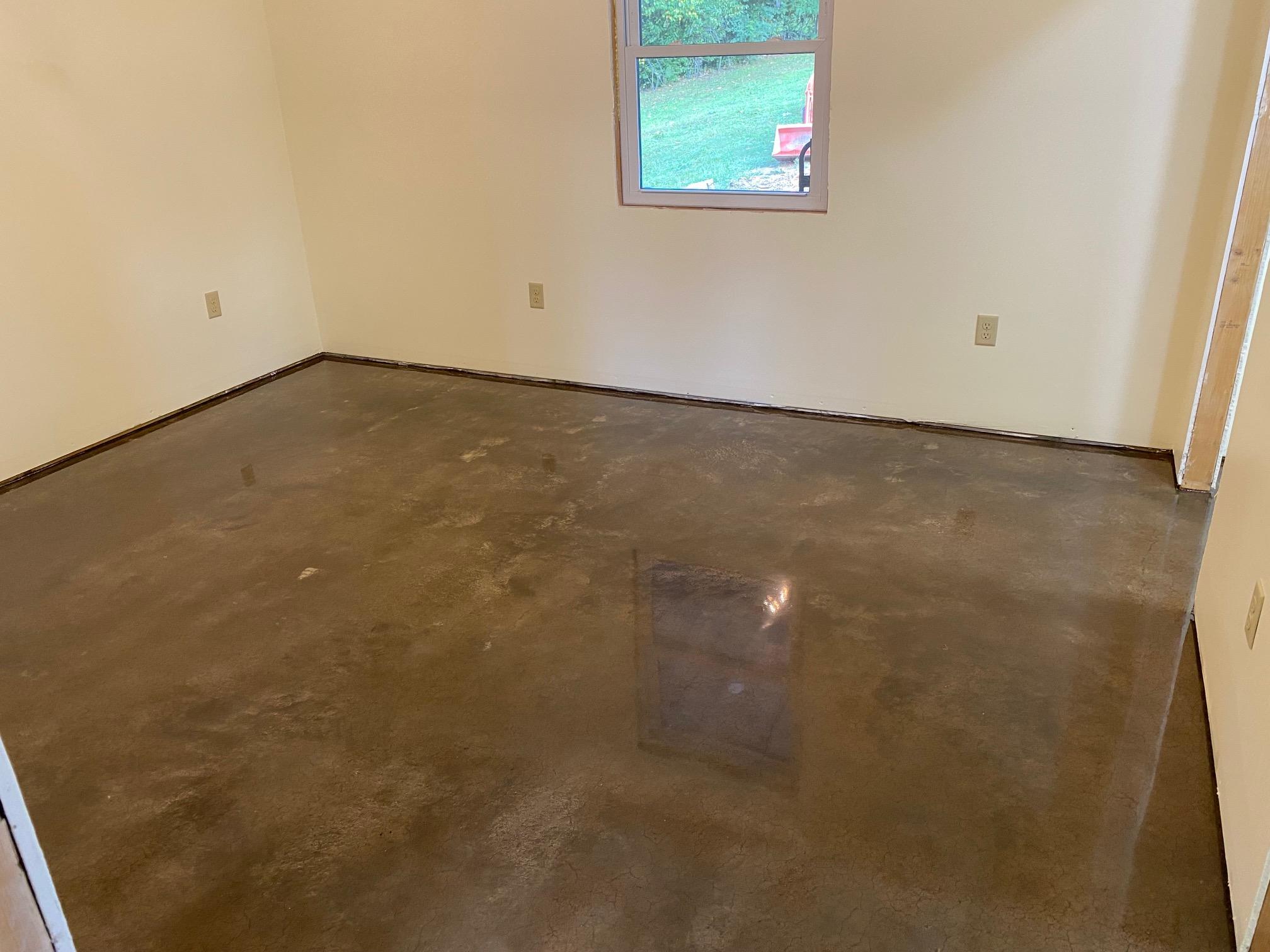 Bedroom concrete floor before metallic epoxy coating