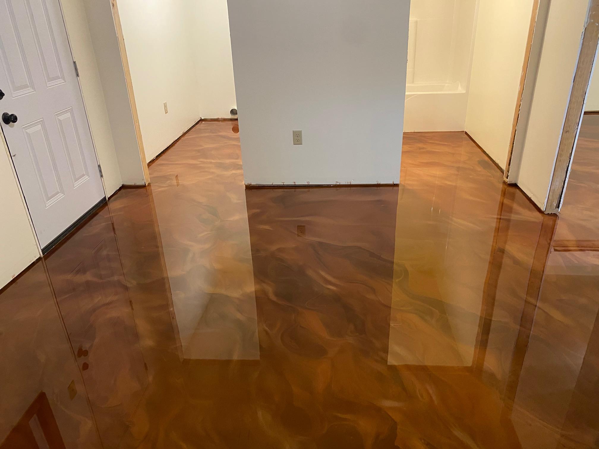 Completed high-gloss metallic epoxy floor after topcoat